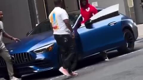 Viral NYC Moment: Man Grabs Another Man’s Face in Heated Street Exchange”
