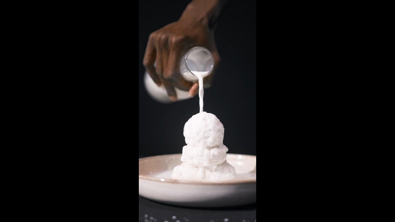 pouring milk on top of soup