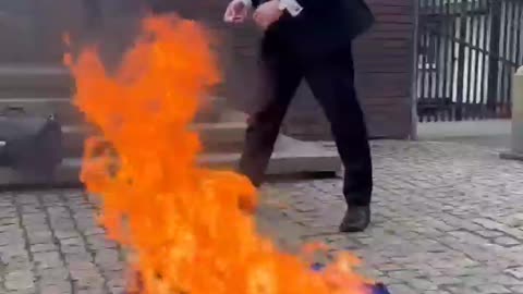 Grzegorz Braun burns an EU (European Union) flag