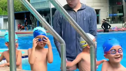 Hunky Chinese Swim Coach Goes VIRAL— Moms Are Losing It!