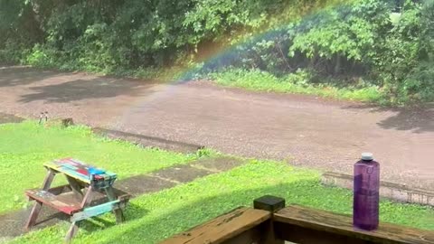 Sun Shower Spawns Mini Rainbow in Front Yard