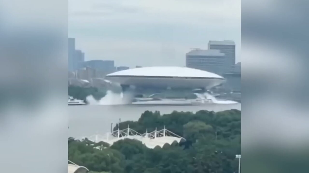 UFO Rises from Center of a City