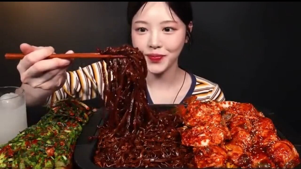 Spicy fried scallops, crab seafood platter with noodles