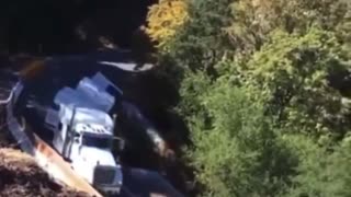 Trucker in California attempts tight turn, falls down side of mountain