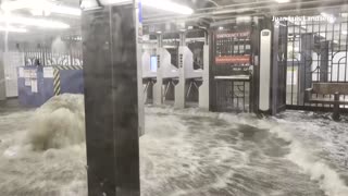 Floodwater gushes into New York subway station during heavy rain