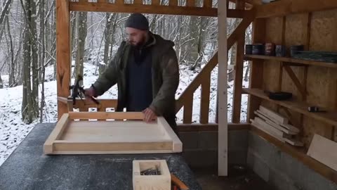 Construction of a wooden house in the forest
