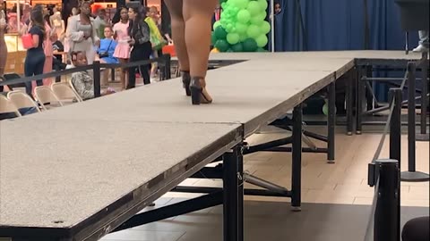 Woman Falls Off Runway During Shapewear Modeling