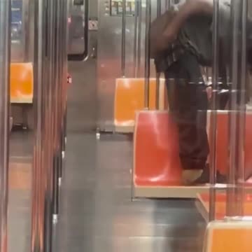 Absolutely disgusting negro rubs his spread cheeks on a subway railing