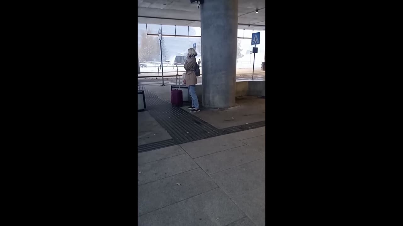 Woman is freezing while waiting for the bus