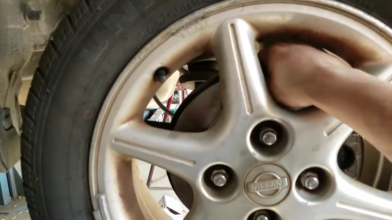 Replace rotors and pads rear in 2001 Nissan Sentra part 2