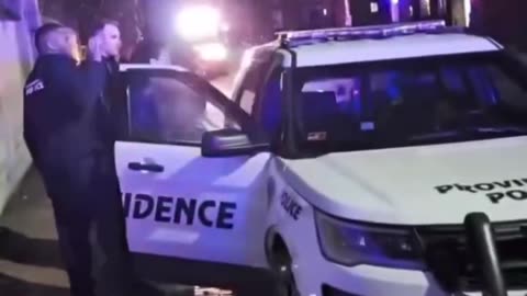 Police arrested a suspect at Brown University, while people nearby asked,