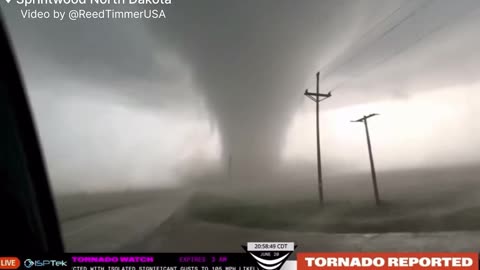 Stormchasers Get Crazy Close to a Large Tornado in North Dakota