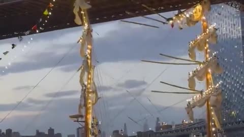 Evening Views of the Brooklyn Bridge and a Majestic Ship
