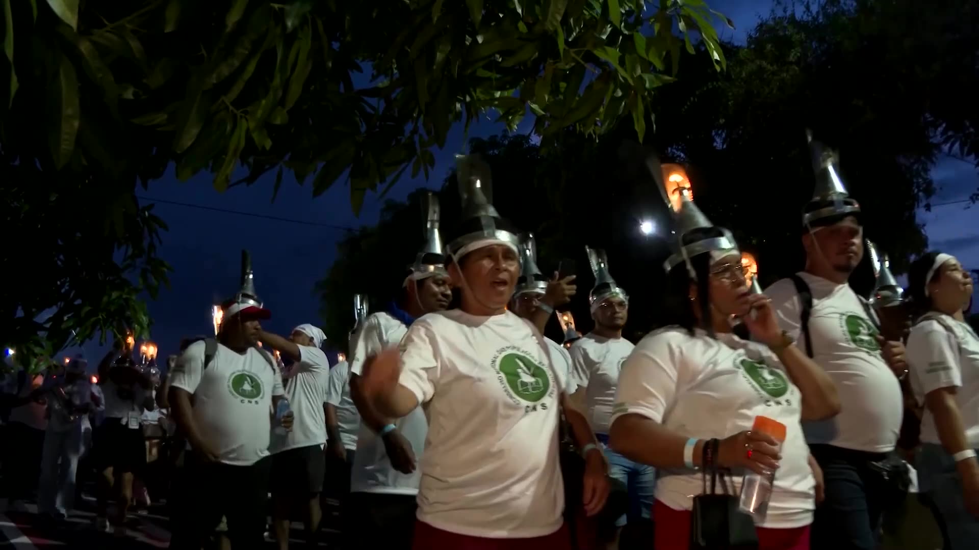 Rural extractivists march with headlamps to defend forests at COP30