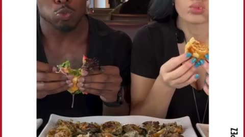 SUV crash through A couple filming a food review