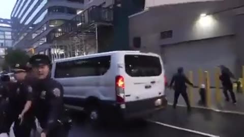 Protesters lay down in the street as a blockade. Police begin forcibly arresting everyone.