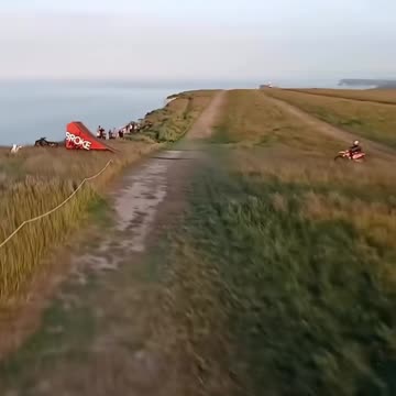 From wheels to wings in 3 seconds flat 🚵‍♂️➡️🪂 #stunt #reels #viral #fyp