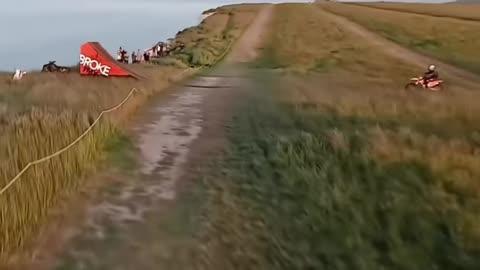 From wheels to wings in 3 seconds flat 🚵‍♂️➡️🪂 #stunt #reels #viral #fyp