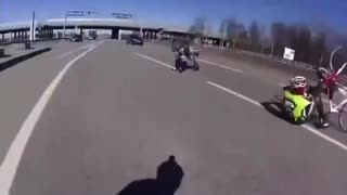 Entitled cyclist riding on a highway gets dropped by a moving truck