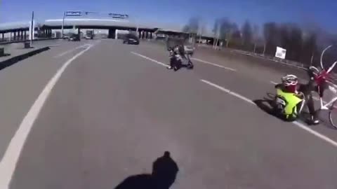 Entitled cyclist riding on a highway gets dropped by a moving truck