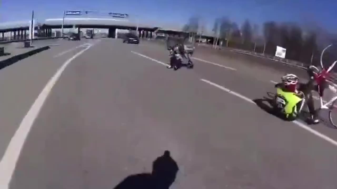 Entitled cyclist riding on a highway gets dropped by a moving truck