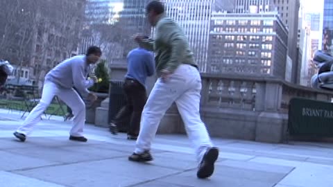 NYPD Police man Stops Capoeira Game, Bryant Park, 42nd St, NYC