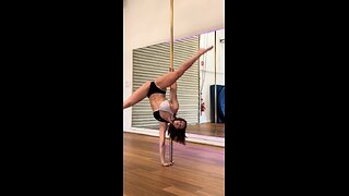 Beautiful fit brunette pole dancing