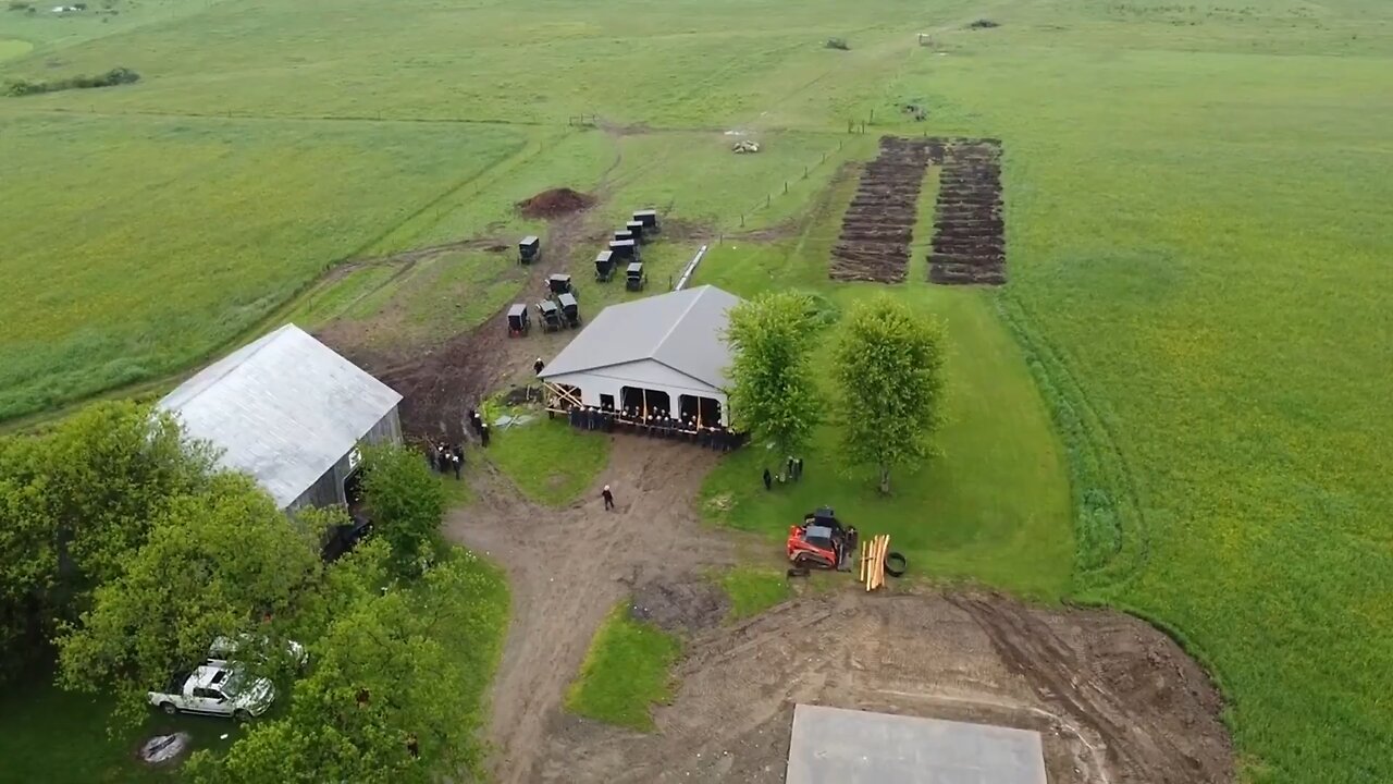 Astonishing drone footage has emerged of 150 Amish men moving a barn