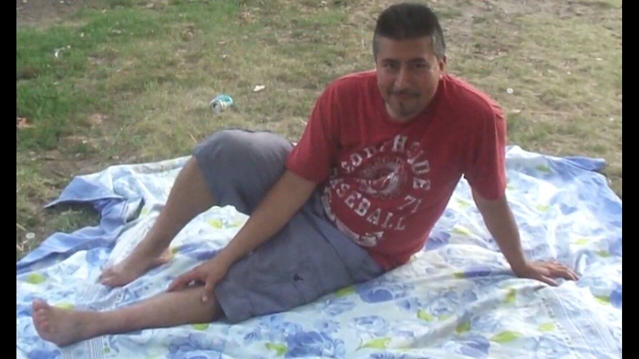 Luodong Massages Mexican Man In Red Shirt At The Park