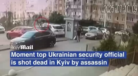 Moment top Ukrainian security official is executed in Kyiv street by masked assassin who then fled