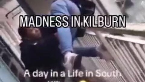 UK, diversity holding a White lady over a balcony, threatening to throw her off