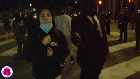 Radical Mexican activists hurl racial slurs at a Black American police officer.