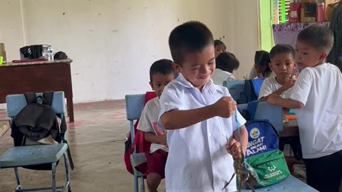 Student Gives His Teacher a Mud Crab