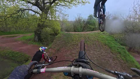 Two Mountain Bikers Nearly Land on Each Other