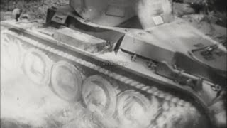 Panzer I and II tanks transported by truck and trailer on maneuvers in 1939