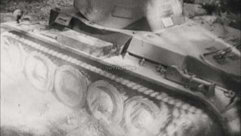Panzer I and II tanks transported by truck and trailer on maneuvers in 1939