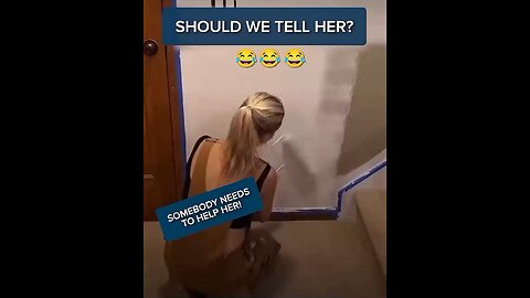woman paints wall