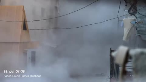 Footage shows a Palestinian boy pedaling through thick dust amid an Israeli raid