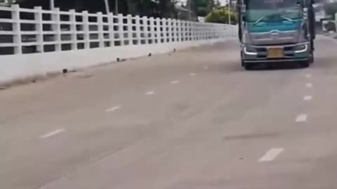 UKRAINIAN armored military vehicles thunder thru Thai street to Cambodia