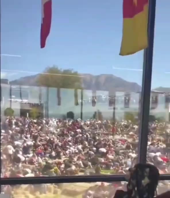 Additional footage shows an individual running across the roof of the Losee Center