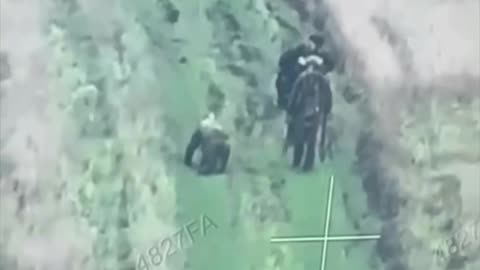 🤯 Russian soldiers calmly walk past their wounded comrade, who is kneeling by in search of help.