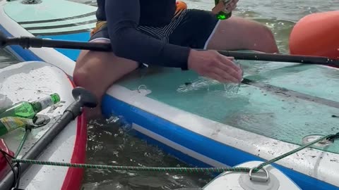Barbequing Sausages On Stand Up Paddleboards