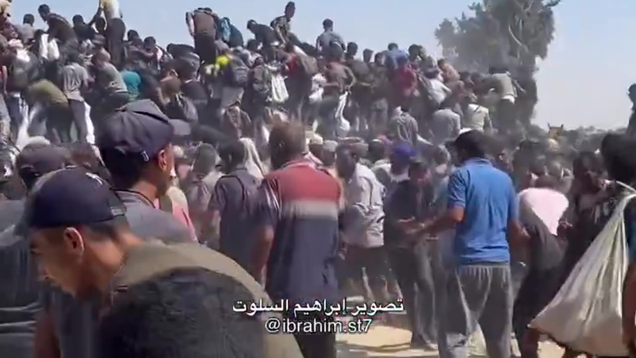 Hundreds of Palestinians crowding around aid trucks north of Rafah