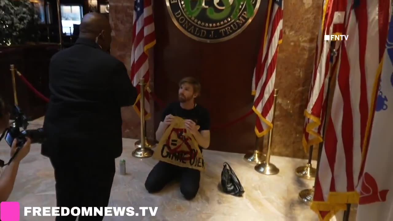 Soyboy Climate activists deface Trump Tower placard with spray paint in NYC