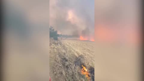 Planes and helicopters drop water on spreading wildfire in Turkey