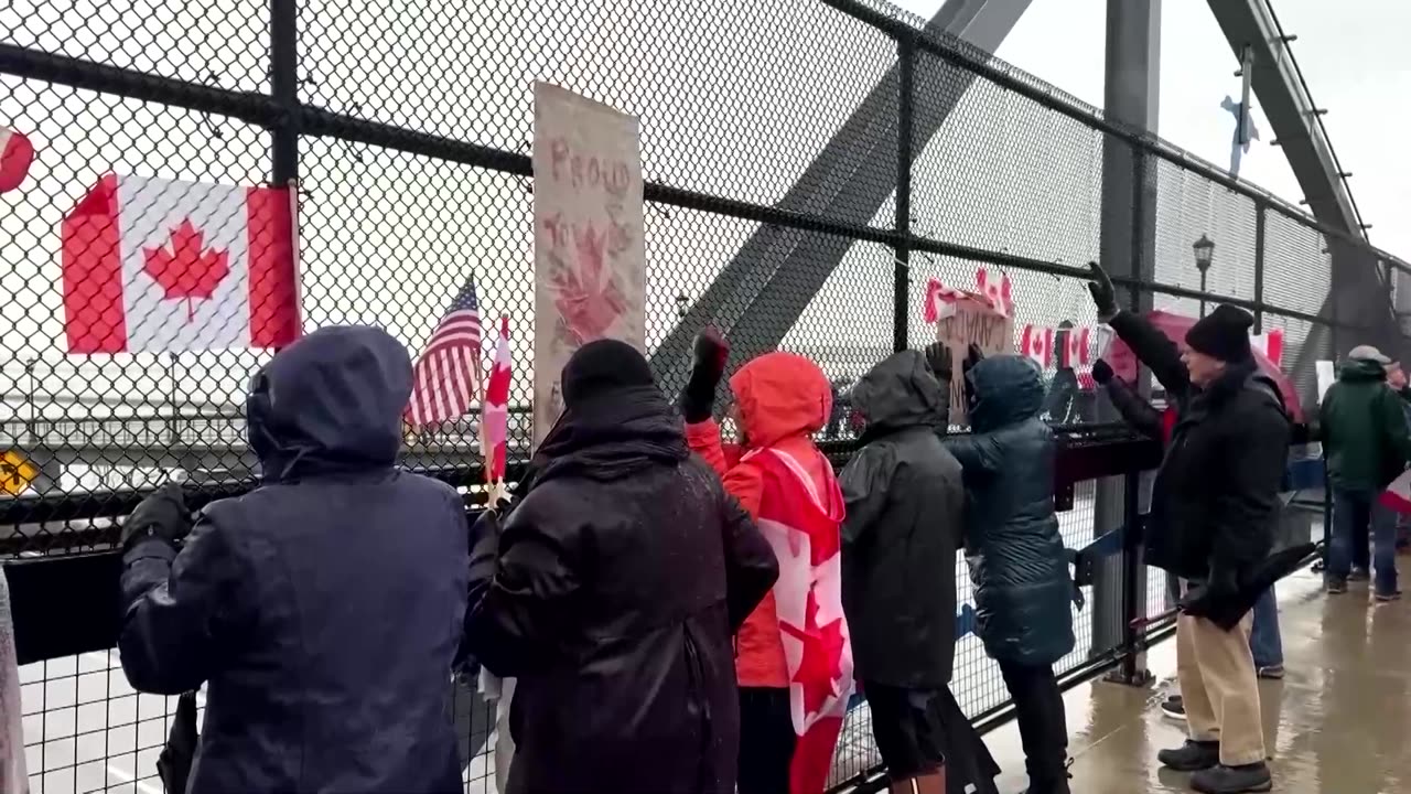 US protesters wave Canadian flags near border in anti-tariff rally
