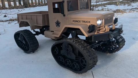 rc military truck on tracks