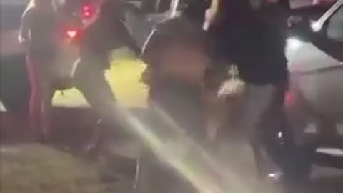 Women try to fight a man