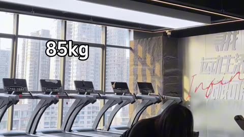Woman Lifting Weights at the Gym