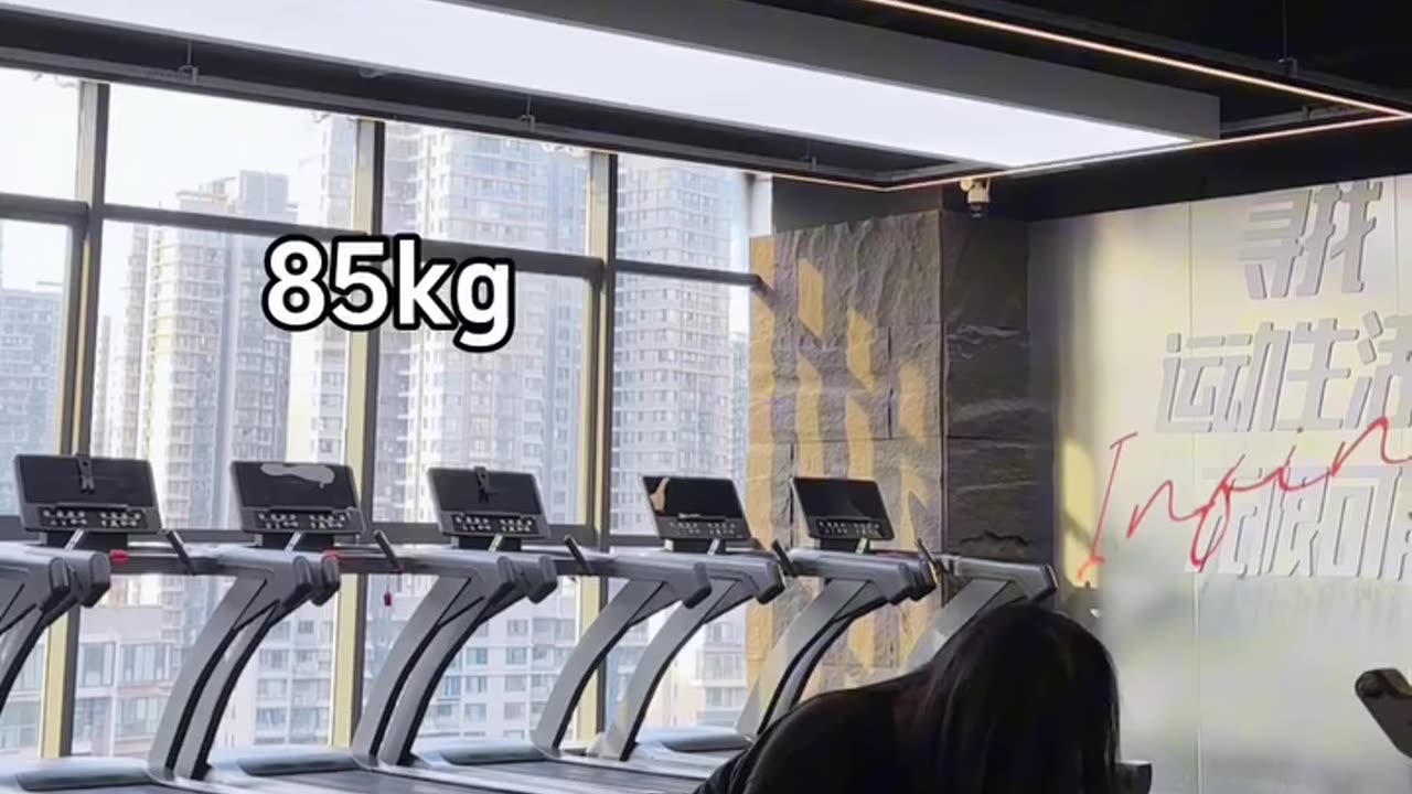 Woman Lifting Weights at the Gym